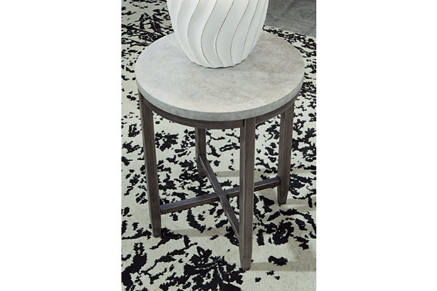 With its casual, linear style design, the Shybourne round end table is a sleek, chic accompaniment to your sofa or sectional seating area. Features faux concrete melamine top with metal base in a dark pewter-tone finish.Faux concrete melamine top | Metal base in dark pewter-tone finish | Assembly required | Estimated Assembly Time: 15 Minutes