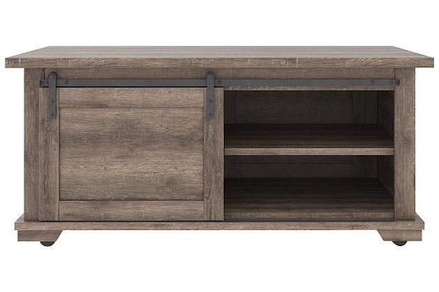 Raise the bar on modern farmhouse design with the Arlenbry storage coffee table. Sporting a handsome weathered oak effect and cross buck accents, the table's unique sliding "barn door" moves to reveal shelved storage space. Easy roll casters add a cool touch that's right on trend.Made of decorative laminate over engineered wood | Replicated weathered oak grain | Barn door slides to reveal open, shelved storage | Casters for easy mobility | Assembly required | Estimated Assembly Time: 60 Minutes
