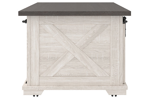 Raise the bar on modern farmhouse design with the Dorrinson coffee table. Sporting a two-tone, gray and antiqued white color scheme and cross buck design, the table's unique sliding "barn door" moves to reveal shelved storage space. Easy roll casters add a cool touch that's right on trend.Made of decorative laminate over engineered wood with two-tone, gray and antiqued white color scheme | Barn door slides to reveal open, shelved storage | Casters for easy mobility | Assembly required | Estimated Assembly Time: 45 Minutes