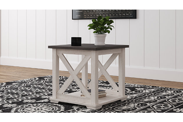 Raise the bar on modern farmhouse design with the Dorrinson end table. Sporting a two-tone, gray and antiqued white color scheme and cross buck design, this table makes a statement wherever it lands. With its generous shelved storage space, this home essential is packed with possibilities.Made of decorative laminate over engineered wood with two-tone, gray and antiqued white color scheme | Assembly required | Estimated Assembly Time: 30 Minutes