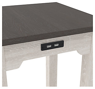 Raise the bar on modern farmhouse design with the Dorrinson side table. Sporting a two-tone, gray and antiqued white color scheme, this piece makes a statement wherever it lands. With its dual USB charging ports, this home essential is packed with possibilities.Made of decorative laminate over engineered wood | Two-tone finish (gray and antiqued white) | Fixed lower shelf | USB charging ports | Power cord included; UL Listed | Assembly required | Estimated Assembly Time: 30 Minutes