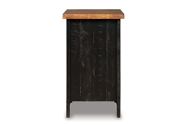 To those with an eye for the best in rustic farmhouse living, the two-tone Valebeck chairside end table doubles up on charm. Designer touches include plank-effect styling, distress marks and a wire mesh door front for added character.Made with pine veneers, pine wood and engineered wood | Two-tone distressed finish (light brown top and rustic vintage black base) | Single door cabinet with metal grill and hardware | Center shelf