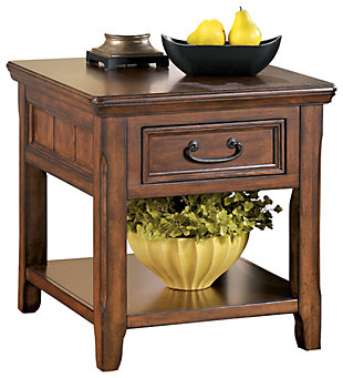 With its heirloom air and richly edited sense of style, the Woodboro rectangular end table is loaded with subtle charm. Distinctive elements including antiqued hardware and weatherworn edging add to its rustic refinement.Made of veneers, wood and engineered wood | Hand-finished | Dark bronze-tone hardware | 1 drawer | 1 fixed shelf | Assembly required