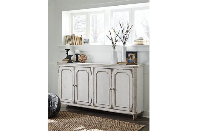 With its distressed vintage paint finish, fluted details and French provincial mouldings, the exquisite Mirimyn cabinet is sure to grace your space in such a très chic way. Adjustable shelved storage is abundantly practical, be it in a dining room, living room or entryway.Made of veneers, wood and engineered wood | 4 cabinet doors revealing 2 adjustable shelves | Assembly required | Excluded from promotional discounts and coupons | Estimated Assembly Time: 30 Minutes