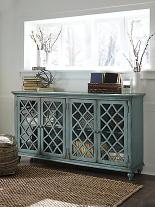 Put your love of shabby chic style on display with the wonderfully versatile Mirimyn cabinet. Adding to the charm of its distressed vintage paint finish: glass-inlay doors with a “free form” lattice design that’s delightfully different. Adjustable shelved storage is abundantly practical, be it in a dining room, living room or entryway.Made of veneers, wood and engineered wood | 4 cabinet doors with glass inlays revealing 2 adjustable shelves | Assembly required | Excluded from promotional discounts and coupons | Estimated Assembly Time: 30 Minutes
