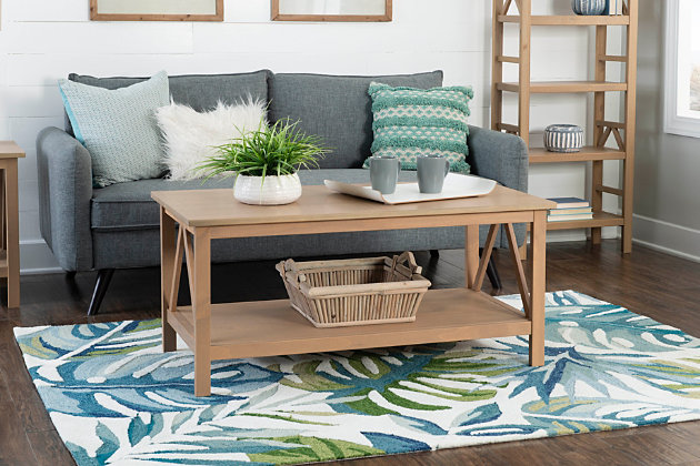 The simple yet eye-catching design of this coffee table features an open framework and linear design for universal appeal. A gracious tabletop and spacious lower shelf provide ample storage and display space. The on-trend finish with driftwood tones suits your appreciation for contemporary style.Made of wood | Finish with driftwood tones | Fixed lower shelf | Assembly required