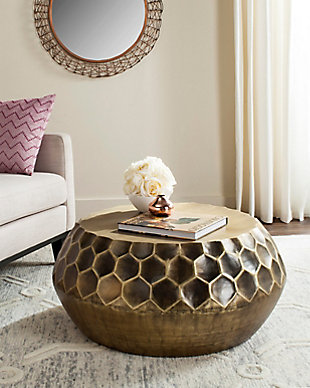 Dripping in honeycomb-shaped hexagons and finished in an antiqued brass-tone patina, this drum table exudes an expensive aesthetic. The fact that it’s utterly affordable sweetens the deal.Made of metal | Antiqued brass-tone finish | Clean with a soft, dry cloth
