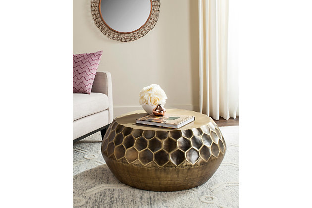 Dripping in honeycomb-shaped hexagons and finished in an antiqued brass-tone patina, this drum table exudes an expensive aesthetic. The fact that it’s utterly affordable sweetens the deal.Made of metal | Antiqued brass-tone finish | Clean with a soft, dry cloth