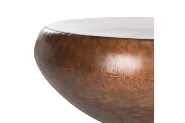 Sporting a sleek industrial look and finished in an antiqued copper-tone patina, this drum table exudes an expensive aesthetic. The fact that it’s utterly affordable sweetens the deal.Made of metal | Antiqued brass-tone finish | Clean with a soft, dry cloth