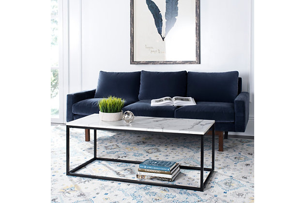 Neutral hues mingle together almost seamlessly on this contemporary coffee table. The faux marble top is supported by an iconic geometric metal base. Both elegant and affordable, the table complements a variety of urban industrial and modern design preferences.Made of engineered wood | Faux marble finish | Black metal frame | Clean with a soft, dry cloth | Assembly required