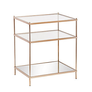 By infusing goldtone metal with both clear and mirrored glass, this decidedly modern end table takes minimalism to the max. Tri-level design gives its fabulous form that much more function.Plated iron frame in goldtone finish | Clear tempered glass tabletop and center shelf | Bottom shelf with mirrored glass top | Assembly required | Assembly time frame is 15 to 30 min.