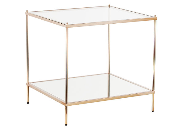 By infusing goldtone metal with both clear and mirrored glass, this decidedly modern end table takes minimalism to the max. Underlying shelf gives its fabulous form that much more function.Plated iron frame in goldtone finish | Clear tempered glass tabletop | Bottom shelf with mirrored glass top | Assembly required | Assembly time frame is 15 to 30 min.