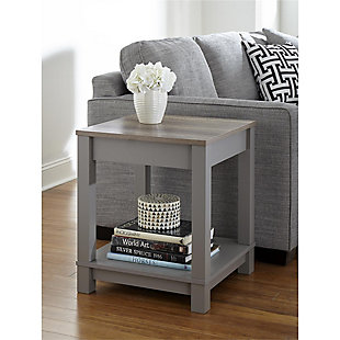 Merging modern and minimalist design, this two-tone end table turns display space into an art form. Dual finish of wood tones and gray is right on trend. Streamlined design proves that less is more.Made of laminated engineered wood | Gray finish with a distressed woodgrain top | 2 levels of display space | Assembly required