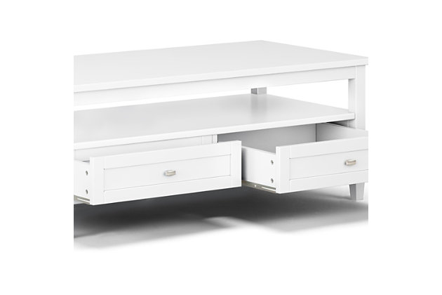 Sometimes you want to be noticed, and sometimes you need to keep a low profile. Keeping this in mind, this Shaker-style coffee table was designed to fit easily in your space and turn heads at the same time. Two bottom drawers open to provide ample storage options for remote controls, magazines and the like while leaving the table surface clutter-free. The open shelf provides additional storage.Dimensions: 22"D x 48" W x 18"H | Handcrafted with care using the finest quality solid wood | Hand-finished in White with a protective NC lacquer | Multipurpose table with storage can be used as coffee or cocktail table. Looks great in your living room, great room, condo, family room or den | Features two bottom drawers with metal drawer glides and large open shelf for plenty of storage | Transitional design includes shaker style drawer fronts, Antique Brass knobs, square tapered legs and square edged table top | Assembly required | We believe in creating excellent, high quality products made from the finest materials at an affordable price. Every one of our products come with a 1-year warranty and easy returns if you are not satisfied.