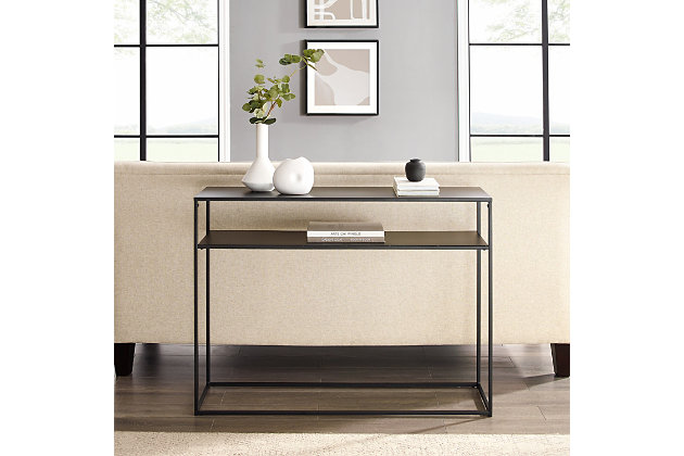 Simple and streamlined, the braxton console table is an ideal addition to your entryway or living room. With clean lines and sturdy steel construction, it offers storage and display space without overwhelming your space. The perfect spot for your favorite books or house plants, this table's slim frame blends seamlessly with your home's decor.Made of steel | Matte black finish | Tabletop and shelf weight capacity 25 lbs. | Modern design | Streamlined space-saving footprint | Modular design allows multiple units to be paired together | Assembly required