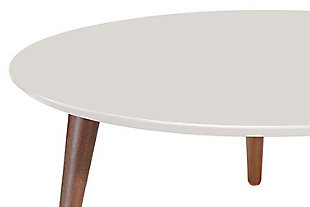 The perfect coffee table has arrived. The bold, expertly crafted and transformative Moore coffee table will completely revamp your living space in the most elegant and subtle way. Splayed legs and an off-white finish add design intrigue and make this a coffee table you’ll enjoy for years to come.Rounded top | Geometric 3-leg base design | Solid wood splayed legs | Off-white finish | Made with engineered wood and wood | Assembly required
