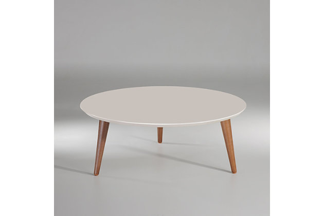 The perfect coffee table has arrived. The bold, expertly crafted and transformative Moore coffee table will completely revamp your living space in the most elegant and subtle way. Splayed legs and an off-white finish add design intrigue and make this a coffee table you’ll enjoy for years to come.Rounded top | Geometric 3-leg base design | Solid wood splayed legs | Off-white finish | Made with engineered wood and wood | Assembly required