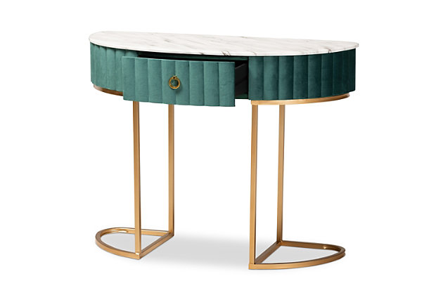 Add unique, glamorous charm to your space with the Beale console table. Made in China, the Beale is comprised of a metal frame finished in a stunning gold tone. The spacious tabletop is upholstered in a sleek marble effect PU leather for a luxurious aesthetic that also serves to declutter busy areas. One drawer provides storage space and is upholstered in green velvet fabric enhanced with alluring channel tufting. A gold-tone ring pull adds an extra touch of glamour. Requiring assembly, its slim frame makes it well suited for tighter spaces. Instantly upgrade your entryway or hallway with the dazzling Beale console table.Constructed from MDF wood and metal | Marble effect PU leather upholstered tabletop | Velvet polyester fabric upholstered drawer | Channel tufted