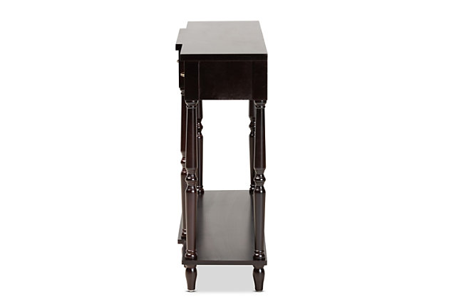 Revitalize your entryway with the elegant and efficient Hallan console table. Made in China, this wood console is equipped with three drawers along with a lower shelf to store mail and display decor. Crisp lines lend a contemporary look, while a dark brown wood finish and ring turned legs add traditional appeal. The Hallan requires assembly and is accented with antique gold tone metal drawer pulls for a touch of vintage charm. With plenty of surface area for storage and decorations, the Hallan console table is a fantastic addition to any entryway.Constructed from firwood and engineered wood | Dark brown finish | Three (3) drawers | Lower shelf