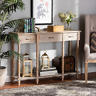Revitalize your entryway with the elegant and efficient Hallan console table. Made in China, this wood console is finished in a whitewashed oak brown that lends rustic, old world appeal. Three drawers and a lower shelf provide space to store mail and display decor. Crisp lines lend contemporary style, while ring turned legs add a traditional look. The Hallan requires assembly and is accented with antique gold tone metal drawer pulls for a touch of vintage charm. With plenty of surface area for storage and decorations, the Hallan console table is a fantastic addition to any entryway.Constructed from firwood and engineered wood | Whitewashed oak brown finish | Three (3) drawers | Lower shelf