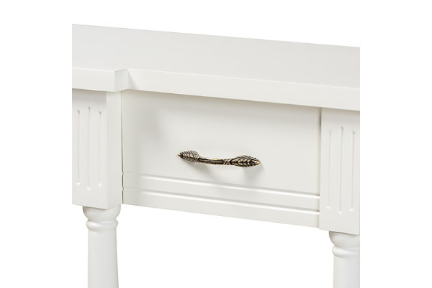 Revitalize your entryway with the elegant and efficient Hallan console table. Made in China, this wood console is equipped with three drawers along with a lower shelf to store mail and display decor. A clean white finish and crisp lines lend a contemporary look, while ring turned legs add traditional appeal. The Hallan requires assembly and is accented with antique gold tone metal drawer pulls for a touch of vintage charm. With plenty of surface area for storage and decorations, the Hallan console table is a fantastic addition to any entryway.Constructed from firwood and engineered wood | White finish | Three (3) drawers | Lower shelf