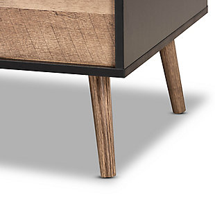 Showcasing splendid modern design influence, the Jensen coffee table adds valuable appeal to any space. Made in China, the Jensen is comprised of sturdy wood showcasing a unique two-tone finish of black and rustic brown. Its versatile design includes a lift top that can be used for eating or working, as well as an inner compartment that provides storage space. Requiring assembly, the Jensen is fitted with angled legs for a touch of mid-century personality. A wonderful piece equipped with both eye-catching design and handy utility, the Jensen is an exceptional addition to the modern living room.Constructed from pine wood and engineered wood | Two-tone rustic brown and black finish | Lift-top tabletop | Interior storage compartment