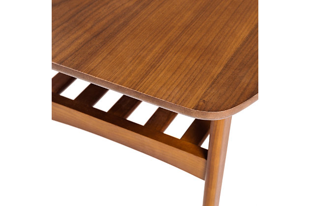 With American walnut veneer on top and a solid wood base, the Carmela side table marries classic craftsman style with a contemporary feel. You could see this table next to cozy leather furniture in a quiet study, or in a bustling family room. Wherever it sits, it feels like home.Made with engineered wood | American walnut veneer over top | Solid wood base and shelf | Slatted shelf | Assembly required