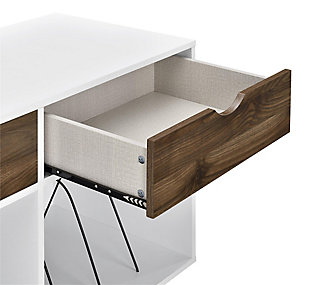Add a blast from the past with the Novogratz Concord Turntable Stand with Drawers. Inspired from mid-century design, the laminated particleboard and MDF complement the black metal hairpin legs for a fun retro look. The white chassis and contrasting medium brown woodgrain drawer fronts pair well with any décor from modern to classic. The double wide stand offers plenty of space to place a record player, speakers, and stereo or even decorations. Keep your remotes, cassette tapes, and record mats or weights for your singles stored away and organized in the 2 drawers. The drawer cutout gives the stand a clean, no-handle look that is easy to open. Keep all of your albums organized in the large open cubbies that feature metal record dividers to keep all of your albums upright. The Novogratz Concord Turntable Stand with Drawers ships flat to your door and 2 adults are recommended for assembly upon opening. The Stand can hold up to 60 lbs. while the cubbies will hold 20 lbs. each. Each drawer can hold up to 15 lbs. Upon assembly, the Stand measures to be 31.8"H x 39.7"W x 18"D.Take it back in time with the novogratz concord turntable stand with drawers | The white laminated particleboard and mdf chassis offer a strong build that complements the mid-century inspired black metal hairpin legs. The contrasting medium brown woodgrain drawer fronts give the stand a classic look to add to any style | The double wide stand offers plenty of space for a record player, speakers and stereo and features 2 large open cubbies with metal dividers to keep your albums upright and organized. Keep your remotes, cassette tapes, and record mats or weights stored away in the 2 spacious drawers | Complete your collection with other novogratz items (sold separately) | The novogratz concord turntable stand with drawers ships flat to your door and 2 adults are recommended for assembly. The stand can hold up to 60 lbs. While the cubbies will hold 20 lbs. Each. Each drawer can hold up to 15 lbs. Assembled dimensions: 31.8"h x 39.7"w x 18"d | 1 year limited warranty included