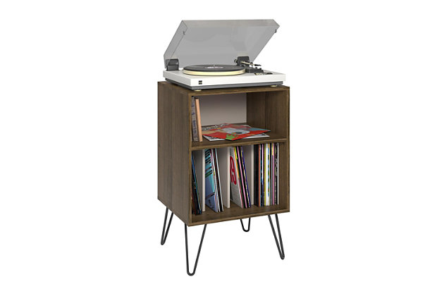 Give your living room or entertainment space a retro look with the Novogratz Concord Turntable Stand. Inspired by mid-century design, the two-tone dark brown woodgrain and gray finish with brown undertones on the laminated particleboard and MDF pairs with the black metal hairpin legs for a retro twist. The Stand is the perfect size to place your record player and the open cubbies offer plenty of options to keep your albums organized. You can store them upright in the 4 lower cubbies or keep your favorites at the top in the large upper cubby. The Novogratz Concord Turntable Stand ships flat to your door and requires assembly upon opening. Two adults are recommended to assemble. The Stand can hold up to 30 lbs. and the large cubby will hold 25 lbs. Each smaller cubby will hold up to 5 lbs. Once assembled, the Stand measures to be 34.1"H x 20.7"W x 18"D.Take it back in time with the novogratz concord turntable stand | Made of laminated mdf and particleboard, the dark brown woodgrain chassis and gray with brown undertones record dividers pairs with the mid-century inspired black metal hairpin legs for a fun, retro look | The stand is the perfect size to place your record player and keep your albums organized in the 4 lower cubbies or keep your favorites at the top in the large upper cubby | Complete your collection with other novogratz items (sold separately) | The novogratz concord turntable stand ships flat to your door and 2 adults are recommended to assemble. The stand can hold up to 30 lbs. And the large cubby will hold 25 lbs. Each smaller cubby will hold up to 5 lbs. Assembled dimensions: 34.1"h x 20.7"w x 18"d | 1 year limited warranty included