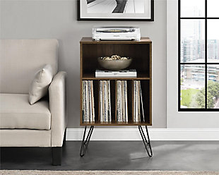 Give your living room or entertainment space a retro look with the Novogratz Concord Turntable Stand. Inspired by mid-century design, the classic medium brown woodgrain laminated particleboard and MDF give the Stand a sturdy build that will last for years while the black metal hairpin legs add a retro twist. The Stand is the perfect size to place your record player and the open cubbies offer plenty of options to keep your albums organized. You can store them upright in the 4 lower cubbies or keep your favorites at the top in the large upper cubby. The Novogratz Concord Turntable Stand ships flat to your door and requires assembly upon opening. Two adults are recommended to assemble. The Stand can hold up to 30 lbs. and the large cubby will hold 25 lbs. Each smaller cubby will hold up to 5 lbs. Once assembled, the Stand measures to be 34.1"H x 20.7"W x 18"D.Take it back in time with the novogratz concord turntable stand | The medium brown woodgrain laminated particleboard and mdf offer a strong build while the mid-century inspired black metal hairpin legs add a fun, retro look | The stand is the perfect size to place your record player and keep your albums organized in the 4 lower cubbies or keep your favorites at the top in the large upper cubby | Complete your collection with other novogratz items (sold separately) | The novogratz concord turntable stand ships flat to your door and 2 adults are recommended to assemble. The stand can hold up to 30 lbs. And the large cubby will hold 25 lbs. Each smaller cubby will hold up to 5 lbs. Assembled dimensions: 34.1"h x 20.7"w x 18"d | 0