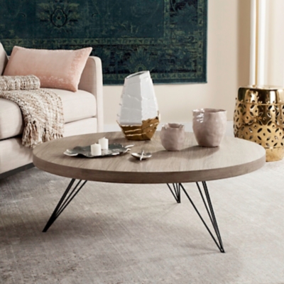 A top ski resort in the Italian alps inspired the modern rustic style of the contemporary Mansel coffee table. Designed for the cosmopolitan interior, its metallic angular base is expertly paired with a warm circular light gray top for timeless sophistication.Made with wood and iron | Top with light gray finish | Imported | Assembly required | Ships directly from third party vendor. See Warranty Information page for terms & conditions.