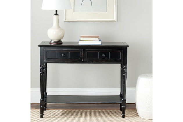 The Samantha console breathes inviting country charm into any hall, entryway or living room with style and ease. The console's classic turned legs and carved details are beautifully spotlighted by the distressed black finish on its pine wood frame.Made with pine wood and aluminum alloy | Distressed black finish | Classic turned legs | Carved details | Imported | Assembly required