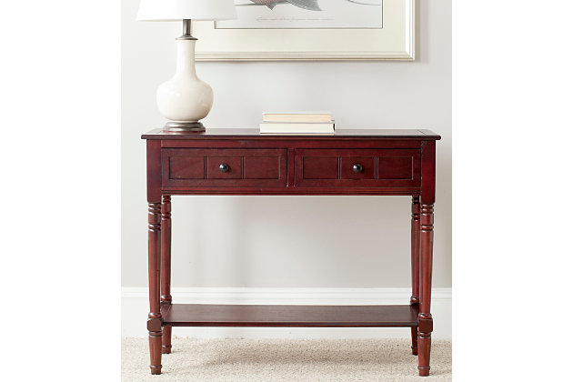 The Samantha console breathes inviting country charm into any hall, entryway or living room with style and ease. The console's classic turned legs and carved details are beautifully spotlighted by the dark cherry finish on its pine wood frame.Made with pine wood and aluminum alloy | Dark cherry finish | Classic turned legs | Carved details | Imported | Assembly required
