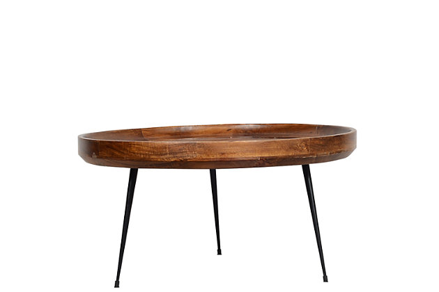 This coffee table is finely constructed from quality mango wood and supported by splayed metal legs. Round in shape, this table features a smooth top with elevated edges that secure objects from falling. Place it in your living room or in garden spaces for instant causally-cool style.Made of mango wood | Elevated edges | Splayed legs | Assembly required