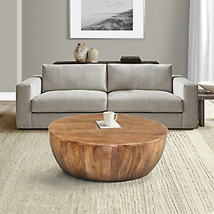 Showcasing a great piece of artistry, this round coffee table features a smooth, wide top that can be used for serving snacks or displaying decor. This piece has a narrow, flat base that provides stability, while the distressed brown finish adds depth to its plank wood texture. There may be a variation in color, finish, wood grain and knots due to various natural and artificial factors.Made of mango wood | Distressed brown finish | Plank wood texture