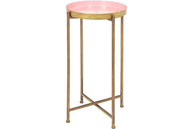 Streamlined and ultra-modern, this accent table is utterly in vogue. Crafted of metal with minimalist-chic styling, the round "tray" tabletop is removable to hold your food and beverages wherever you are. Made of metal | Base with goldtone finish | Tray tabletop with pink finish | Handcrafted