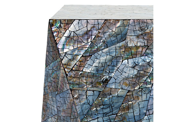 Make a style statement with this uniquely shaped iridescent end table. Constructed with engineered wood and shell, the end table's compelling global-inspired design will add eclectic charm to any room in your living space.Made of engineered wood and coastal shell | Multicolored finish | Handcrafted | No assembly required