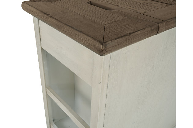 Display and contain your favorite things with the Bolanburg end table. Its textured antique white finish creates a vintage two-tone look, while outlets and USB ports provide functionality. This is a piece you will enjoy for years to come.Made of veneers, wood and engineered wood | Two-tone antiqued finish | Metal hardware | Pull-out tray | Single cabinet storage | Lift-top back revealing 2 electrical outlets and 2 USB charging stations | Power cord included; UL Listed | Minor assembly required