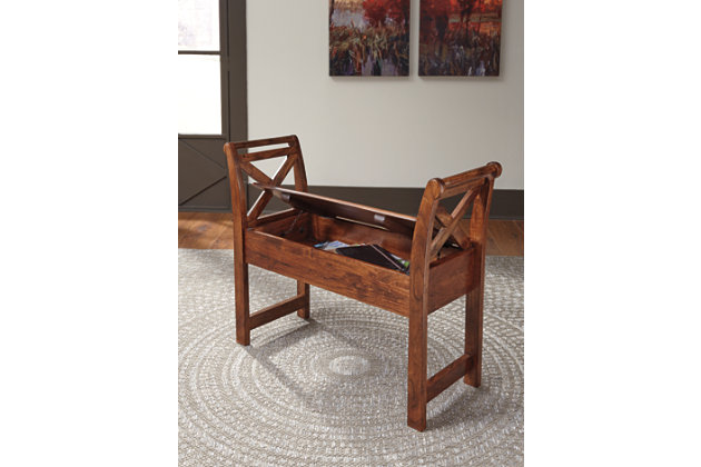 The Abbonto bench is the perfect addition for any room that needs a little extra seating. Beautiful brown color and X-design on the sides give the right amount of style to this sturdy piece. Need to put away a few things? Lift the seat top to reveal storage.Made of acacia wood with warm brown finish | Seat with storage | Assembly required | Excluded from promotional discounts and coupons | Estimated Assembly Time: 15 Minutes