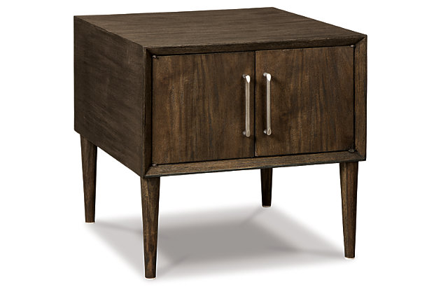 With its tapered peg legs and low, linear profile, the Kisper end table with cabinet storage space is a mastery in mid-century minimalism. The look may be high-end gallery design, but the price is beautifully down to earth.Made of veneers, wood and engineered wood | Cabinet storage space | Aged pewter tone hardware | Assembly required | Estimated Assembly Time: 15 Minutes