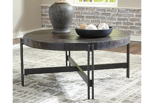 Round out your seating area with the Jillenhurst coffee table in a contemporary mixed-media design. Clean-lined metal base is simple, yet striking—while its rustic mango wood top is anything but ordinary. A rich tobacco-brown finish enhances the wood's tonal variation for a look sure to entice.Made of mango wood | Rich tobacco-brown finish | Metal frame with a raw steel-tone finish | X-base design | Assembly required | Estimated Assembly Time: 30 Minutes