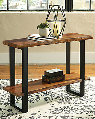 Enjoy the authentic look of “live” edge wood furnishings minus the hefty price tag with the Brosward sofa table. Rich, natural wood finish shelves, crafted with acacia veneers, are a look with real staying power. The dramatically cool “sled” legs add a contemporary vibe perfect for your urban loft or boho abode.Made of acacia wood and engineered wood | Two-tone finish; natural wood finish top on a black frame | Faux “live” edge top on 2 sides for a natural look | Sled style legs | Assembly required | Estimated Assembly Time: 30 Minutes