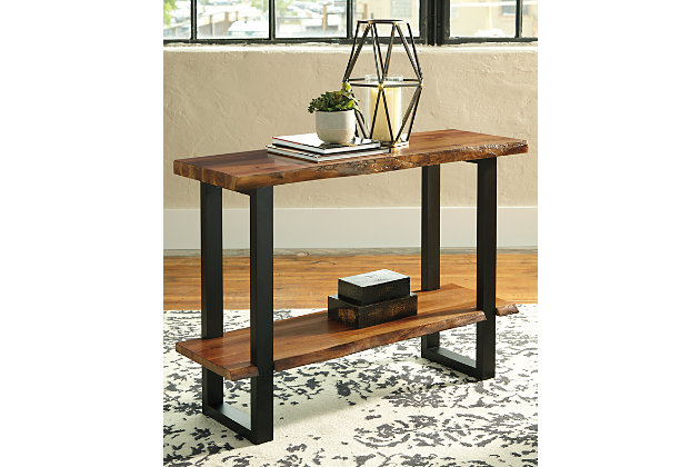 Enjoy the authentic look of “live” edge wood furnishings minus the hefty price tag with the Brosward sofa table. Rich, natural wood finish shelves, crafted with acacia veneers, are a look with real staying power. The dramatically cool “sled” legs add a contemporary vibe perfect for your urban loft or boho abode.Made of acacia wood and engineered wood | Two-tone finish; natural wood finish top on a black frame | Faux “live” edge top on 2 sides for a natural look | Sled style legs | Assembly required | Estimated Assembly Time: 30 Minutes