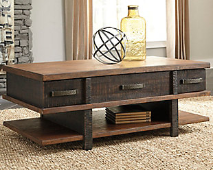 Earthy, rustic character. Clean, contemporary lines. The best of both stack up beautifully in the Stanah lift top coffee table. A simple, blocky profile is enriched with a two-tone finish with deep distressing for a decidedly different aesthetic.Made of veneers, wood and engineered wood | Two-tone treatment | Heavily textured distressing | 2 smooth-gliding drawers | Hammered-style metal pull | Lift-top design with storage underneath | Assembly required | Estimated Assembly Time: 30 Minutes