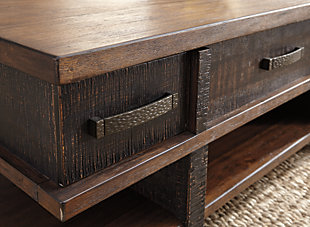 Earthy, rustic character. Clean, contemporary lines. The best of both stack up beautifully in the Stanah lift top coffee table. A simple, blocky profile is enriched with a two-tone finish with deep distressing for a decidedly different aesthetic.Made of veneers, wood and engineered wood | Two-tone treatment | Heavily textured distressing | 2 smooth-gliding drawers | Hammered-style metal pull | Lift-top design with storage underneath | Assembly required | Estimated Assembly Time: 30 Minutes
