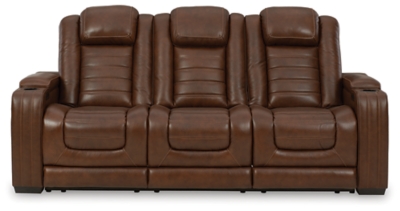 With its fashion-forward sense of style, the Backtrack power reclining sofa has you covered with high-tech advancements and down-home comfort. For starters, the seating area and armrests are upholstered in real leather for true indulgence where it matters most. Love being pampered? With the touch of a button, experience the pure bliss of an air massage system (with three settings), or chill out with the heated seat element. Distinctive elements of this power recliner include contemporary waterfall tufting that beautifully goes with the flow and a zero-gravity mechanism further raising the ottoman for better blood flow. Dual-sided recliner | One-touch power control with adjustable positions, Easy View™ adjustable headrest and zero-draw USB plug-in | Zero-draw technology only consumes power when the USB receptacle is in use | Air massage system includes 3 settings: steady, pulse and wave (with automatic 20-minute shutoff feature) | Heat in the seat element (with automatic 30-minute shutoff feature) | Corner-blocked frame with metal reinforced seat | Attached back and seat cushions | High-resiliency foam cushions wrapped in thick poly fiber | Hidden armrest storage compartments | Zero-gravity mechanism (raises the ottoman to 23" off the floor for improved blood flow) | Extended ottoman for enhanced comfort | Leather interior seating; vinyl/polyester exterior upholstery | Middle seat with flip-down table and 2 cup holders | Estimated Assembly Time: 15 Minutes