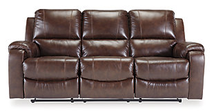 Once you recline in the Rackingburg dual reclining power sofa at the push of a button, you will not want to get up. It's that comfortable with bustle backs and padded ottomans. Its look is amazing with dramatic cut and sew lines, jumbo stitching and affordable mahogany leather match upholstery, which features top-grain leather in the seating areas with skillfully matched vinyl everywhere else—what a way to relax.Dual-sided recliner; middle seat remains stationary | One-touch power controls with adjustable positions | Bustle backs | Attached cushions | Corner-blocked frame with metal reinforced seat | Leather interior upholstery/polyester and vinyl exterior upholstery | High-resiliency foam cushions wrapped in thick poly fiber | Power cord included; UL Listed