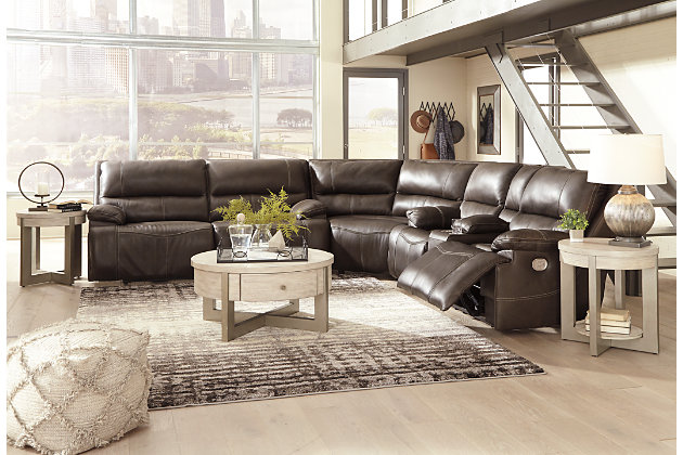 Life is so much better when you can enjoy the pleasure of real leather—at a price to put you at ease. That’s exactly what you get with the Ricmen sectional with power. Thanks to real leather throughout the seating area, you've got a reclining sectional that feels like a million bucks but won’t break the bank. Tailored to those with an eye for contemporary design, this power reclining sectional is dressed to impress with an upscale matte finish, clean-lined divided back tufting, distinctive jumbo stitching and chic pillow top armrests. Perhaps best of all: Easy View™ power adjustable headrests let you recline back and still have a primo view of the TV.Includes 3 pieces: power reclining loveseat, 2 seat power reclining sofa and wedge | Dual-sided recliner | One-touch power control with adjustable positions | Corner-blocked frame with metal reinforced seat | Attached cushions | High-resiliency foam cushions wrapped in thick poly fiber | USB charging port in power control | Easy View™ power adjustable headrests | Loveseat console with storage and 2 cup holders | Leather interior upholstery; vinyl/polyester exterior upholstery | Power cord included; UL Listed | Estimated Assembly Time: 10 Minutes