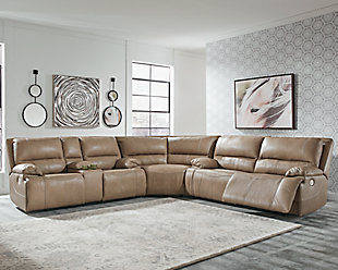 Life is so much better when you can enjoy the pleasure of real leather—at a price to put you at ease. That’s exactly what you get with the Ricmen reclining sectional with power. Thanks to real leather throughout the seating area, you've got a reclining sectional that feels like a million bucks but won’t break the bank. Tailored to those with an eye for contemporary design, this power reclining sectional is dressed to impress with an upscale matte finish, clean-lined divided back tufting, distinctive jumbo stitching and chic pillow top armrests. Perhaps best of all: Easy View™ power adjustable headrests let you recline back and still have a primo view of the TV.Includes 3 pieces: power reclining loveseat, 2 seat power reclining sofa and wedge | Dual-sided recliner | One-touch power control with adjustable positions | Corner-blocked frame with metal reinforced seat | Attached cushions | High-resiliency foam cushions wrapped in thick poly fiber | USB charging port in power control | Easy View™ power adjustable headrests | Loveseat console with storage and 2 cup holders | Leather interior upholstery; vinyl/polyester exterior upholstery | Power cord included; UL Listed | Estimated Assembly Time: 10 Minutes