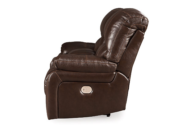 Fashion-forward style. Sumptuous leather feel and appeal. Total comfort at your fingertips. It’s all yours for the ta with the Hallstrung power reclining loveseat with console. Wrapped in a rich chocolate brown upholstery, this decidedly contemporary power loveseat tantalizes the senses in so many ways. Rest assured, the seating area is covered in 100% leather for your pleasure, while a skilly matched faux leather on the exterior makes luxury affordable. Upping the comfort with 44" high back styling, this power loveseat truly caters from head to toe. An Easy View™ power adjustable headrest allows you to lean back while propping up your head—perfect for chilling out in front of the TV—while an extended ottoman lets you stretch out all the more. And with a USB port in each power control panel, you hardly have to move a muscle to stay powered up.Dual-sided recliner | One-touch power controls with adjustable positions | Corner-blocked frames with metal reinforced seats | Easy View™ power adjustable headrests | 44" high back design | Attached backs and seat cushions | High-resiliency foam cushions wrapped in thick poly fiber | Leather interior upholstery; polyester/vinyl upholstery | Lift-top storage console and 2 stainless steel cup holders | Extended ottomans for enhanced comfort | Includes USB charging port in each power control | Power cord included; UL Listed | Estimated Assembly Time: 15 Minutes